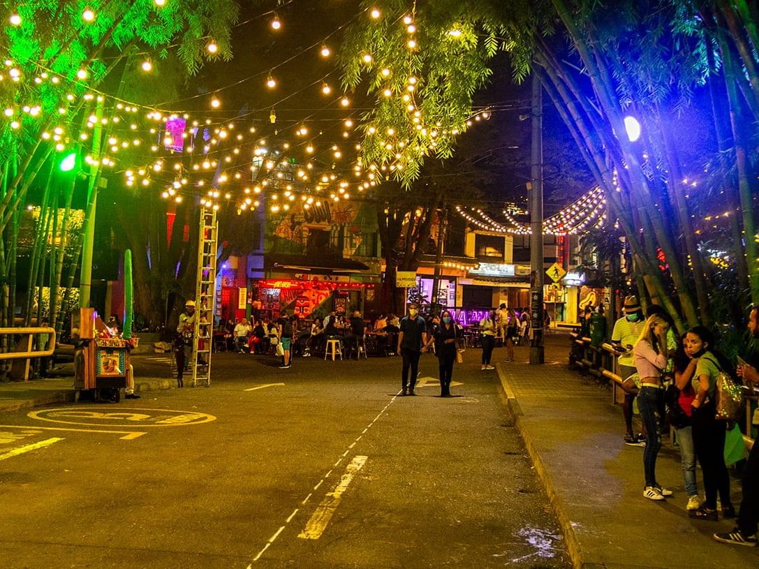 Nightlife lights in Provenza Medellín for a birthday group trip planning page